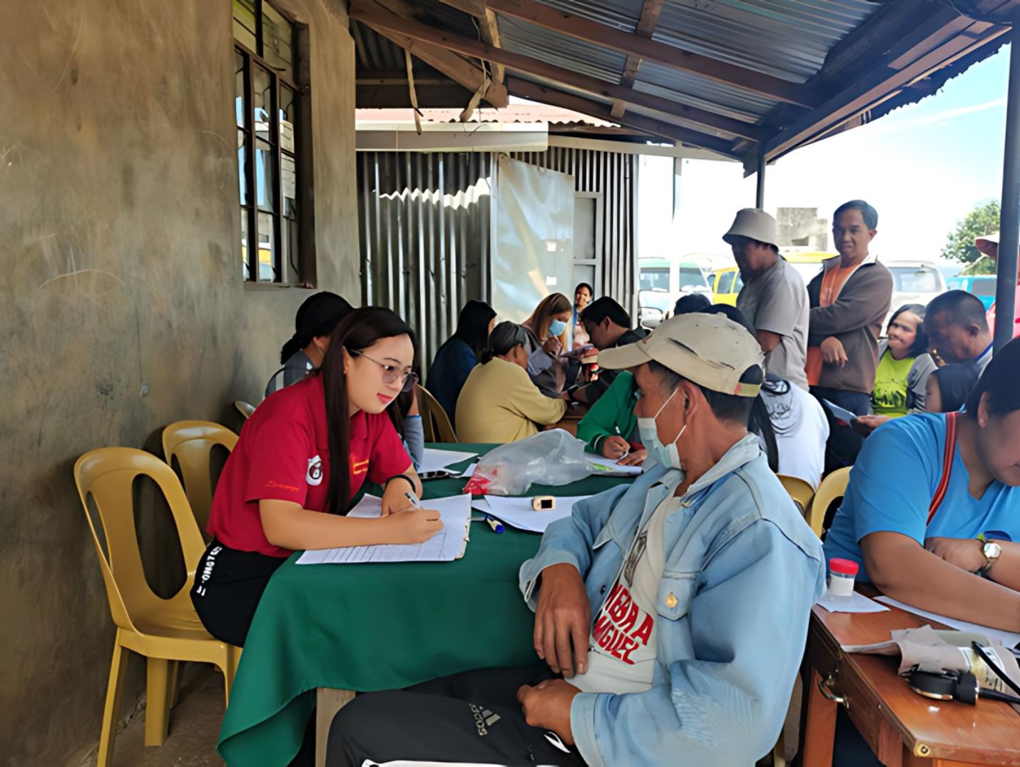 A group of people sitting at a table

Description automatically generated