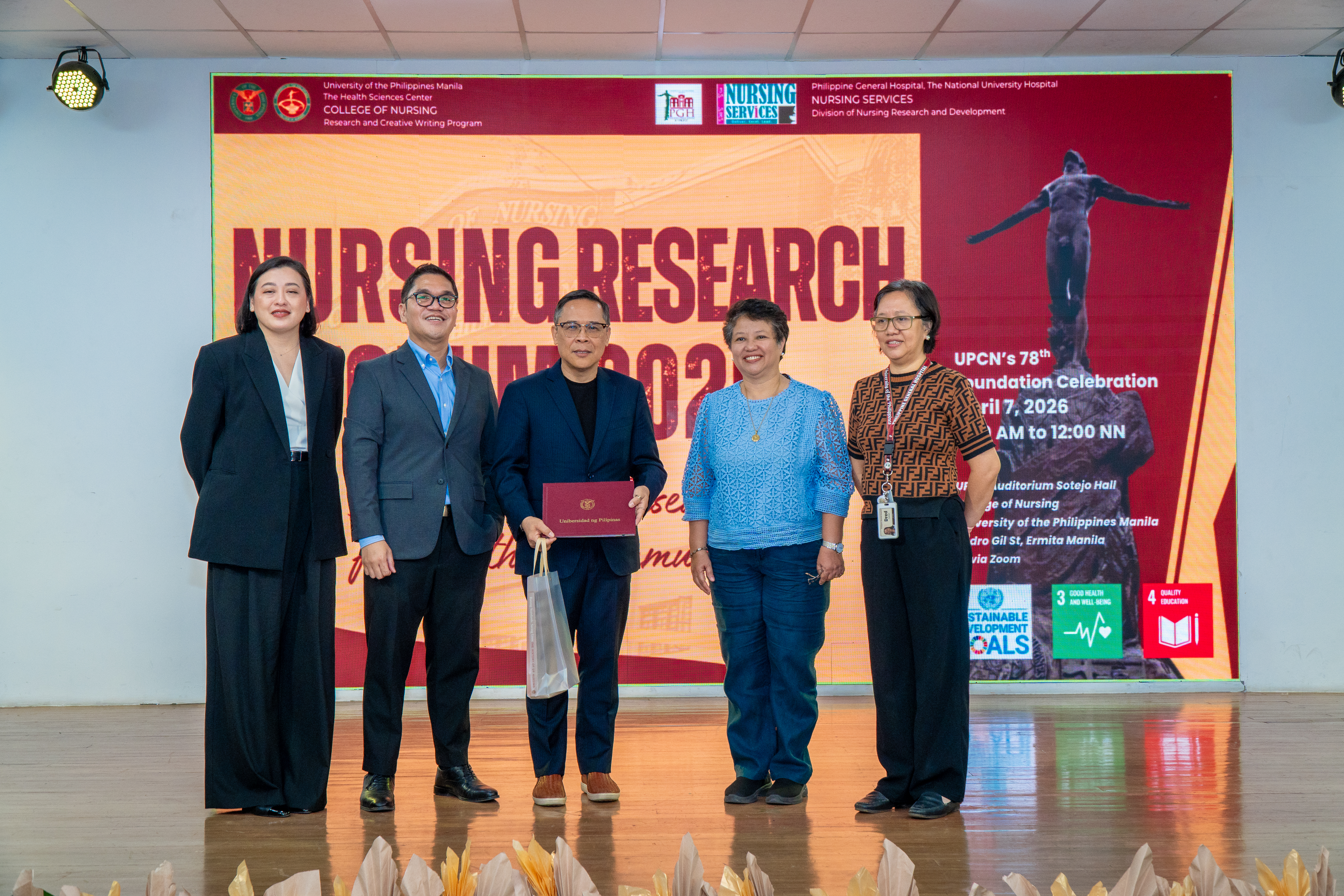 Emerson Ea, Chair of the Nursing Department at New York City College of Technology, USA, receives a certificate of appreciation from University of the Philippines Manila College of Nursing (UPCN) faculty and forum organizers during the Nursing Research Forum 2026 on April 7, 2026.